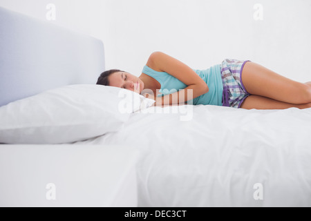 Pretty woman lying in bed Stock Photo