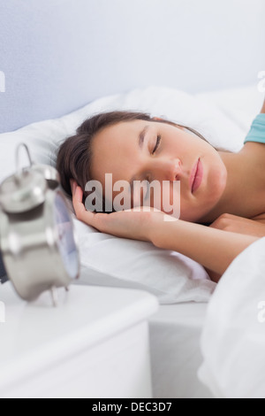 Woman sleeping peacefully in bed Stock Photo