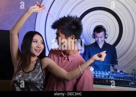 A young couple dancing in nightclub Stock Photo