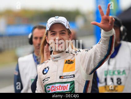 Oschersleben, Germany. 15th Sep, 2013. The Brazilian BMW-Pilot Augusto Farfus cheers after winning the 8th race of the DTM in the etropolis Motorsport Arena in Oschersleben, Germany, 15 September 2013. Photo: JENS WOLF/dpa/Alamy Live News Stock Photo