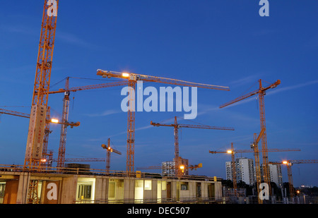 Construction cranes on the construction site of the Milaneo at dusk, Stuttgart, Baden-Württemberg, Germany Stock Photo