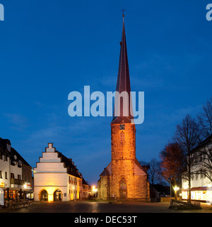 Illuminated Ruhrtalmuseum and St. Victor's Church at dusk, Schwerte, North Rhine-Westphalia, Germany Stock Photo