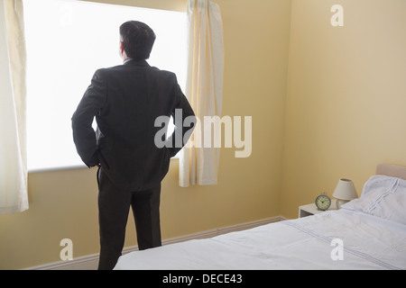Man standing in front of the window Stock Photo