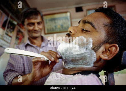 Mauritius Island Man working inside a bus Stock Photo: 16579439 - Alamy