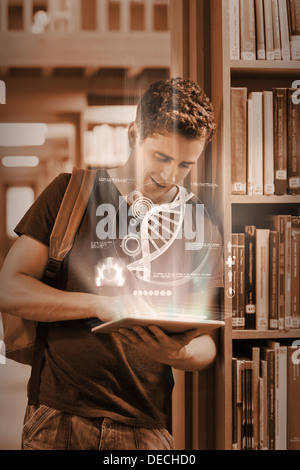 Focused student working on his futuristic tablet Stock Photo
