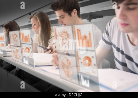Serious students working on their digital tools Stock Photo