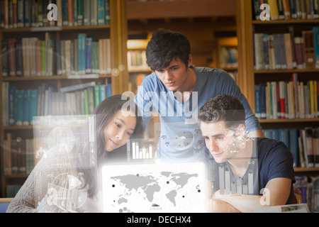 Focused students working on digital interface Stock Photo