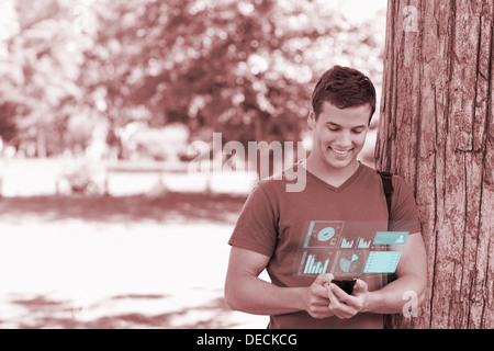 Happy handsome student using his digital smartphone Stock Photo