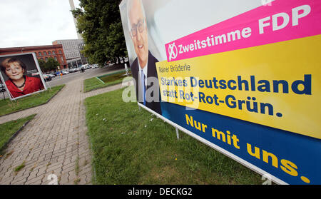 FDP has started a poster campaign to attract so-called 'second votes' (There are two votes in German elections: The first for a local candidate, the second for a party's state-wide list of candidates.) after the defeat in the Bavarian state elections in Berlin, Germany, 16 September 2013. An election poster with German chancellor Merkel is pictured on the left. Photo: WOLFGANG KUMM Stock Photo