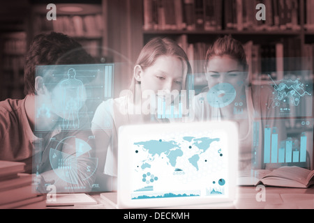 Cheerful college friends studying geography on digital interface Stock Photo