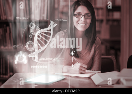 Cheerful mature student studying medicine on digital interface Stock Photo