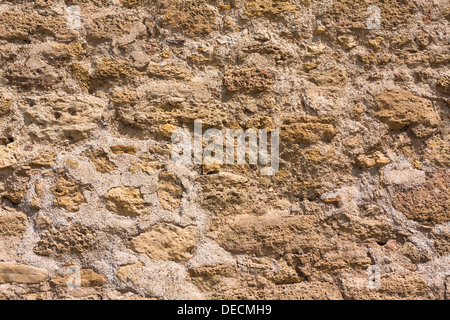Old wall made of the Jerusalem stone. Wall constructed of stone bricks. Stock Photo