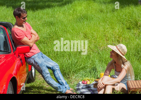 Cheerful couple having picnic together Stock Photo