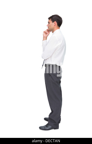 Thoughtful young businessman looking away Stock Photo