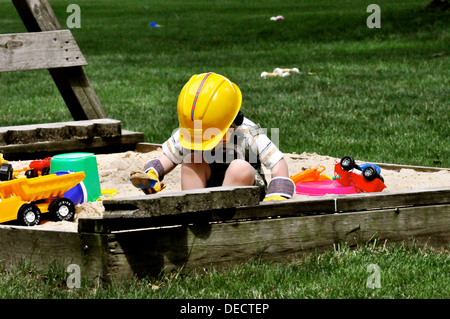 Boy plaing in sand Stock Photo
