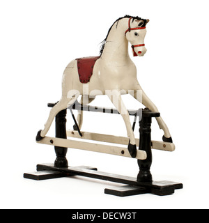 Vintage rocking horse on wooden frame Stock Photo