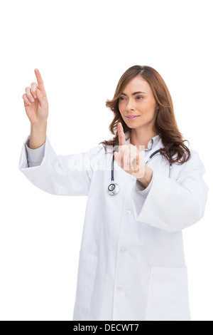 Brunette doctor posing with fingers up Stock Photo