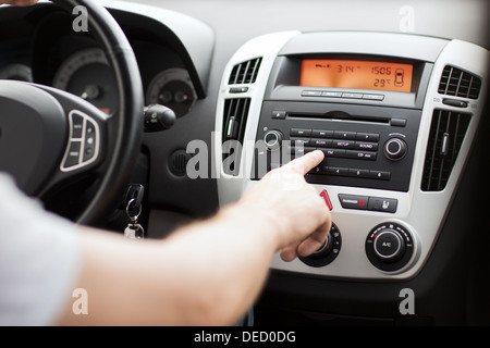 man using car audio stereo system Stock Photo