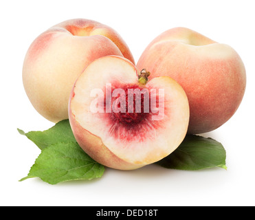 Three peaches with green leaves isolated on white Stock Photo