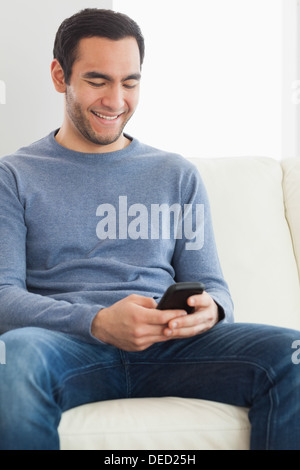 Handsome casual man text messaging Stock Photo