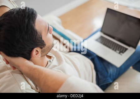 High angle view of relaxed young man using his laptop Stock Photo