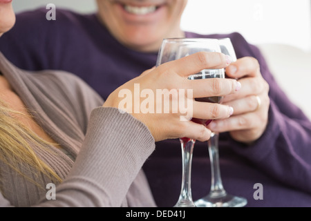 Smiling couple toasting with wine Stock Photo