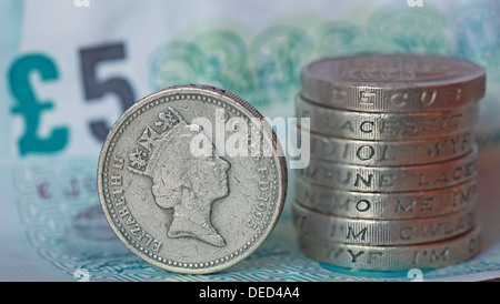 British Sterling Pound coins stacked spelling economy Stock Photo
