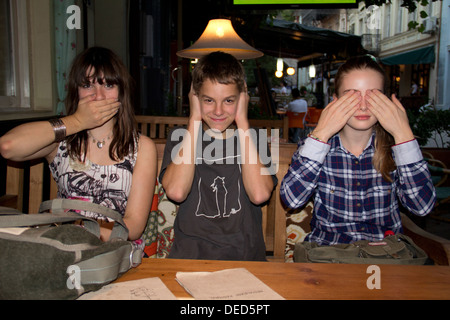 Tbilisi, Georgia, Georgian youth hold mouth, ears and eyes Stock Photo