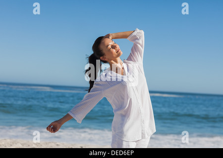 Attractive woman relaxing the sun Stock Photo