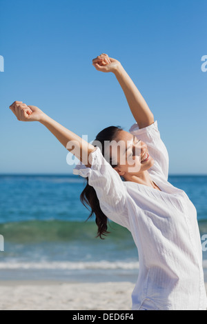 Brunette woman stretching Stock Photo
