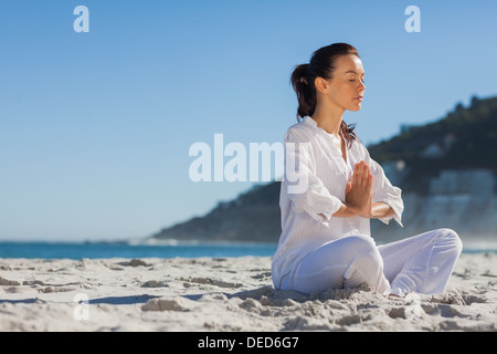 Calm woman practicing yoga Stock Photo