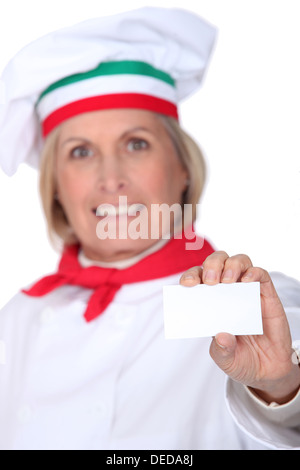 Italian chef with a blank business card Stock Photo