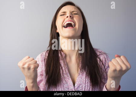 Victorious classy brunette posing Stock Photo
