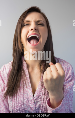 Victorious stylish brunette posing Stock Photo
