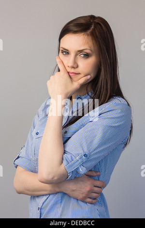 Pensive pretty brunette posing Stock Photo