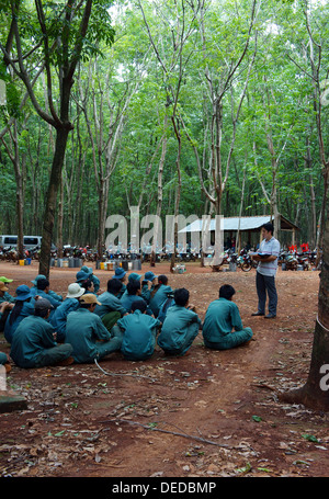 Rubber worker meeting after working session at rubber plantation Stock Photo