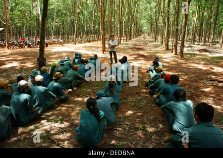 Rubber worker meeting after working session at rubber plantation Stock Photo