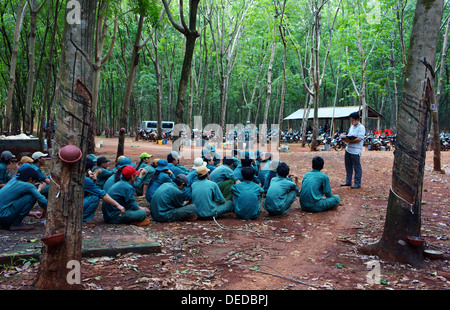 Rubber worker meeting after working session at rubber plantation Stock Photo