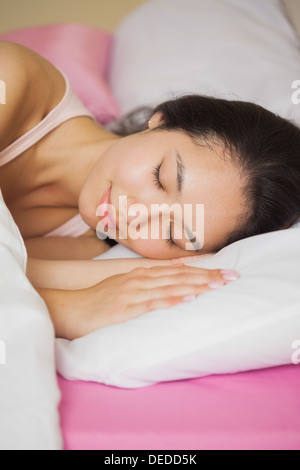 Pretty young asian woman sleeping in her bed Stock Photo
