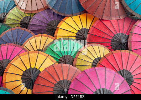 Multicoloured paper umbrellas or parasols on display at  Luang Prabang evening market, Laos Stock Photo