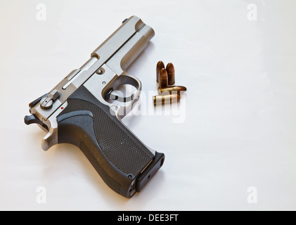 Semi-automatic pistol and bullets Stock Photo