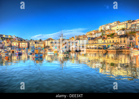 Brixham harbour Devon with boats blue sky and houses on hill in HDR Stock Photo