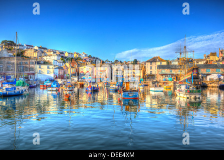 Brixham harbour Devon with boats blue sky and houses on hill in HDR Stock Photo