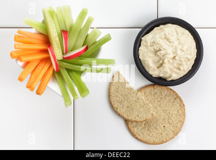 Houmous or Hummus with fresh vegetables and oatcakes Stock Photo