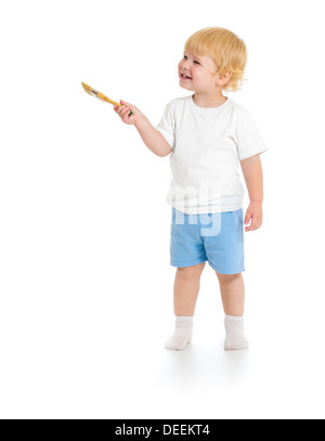 Baby boy with paint brush front view standing full length isolated on white background Stock Photo