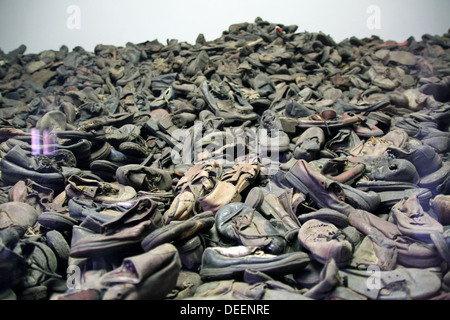 Behind a display glass, shoes of Jewish victims of the Holocaust at Auschwitz-Birkenau concentration camp near Krakow. Stock Photo
