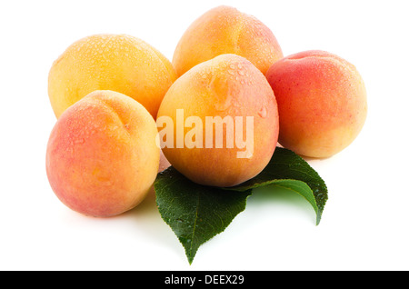 Sweet peaches with leafs on a white background Stock Photo