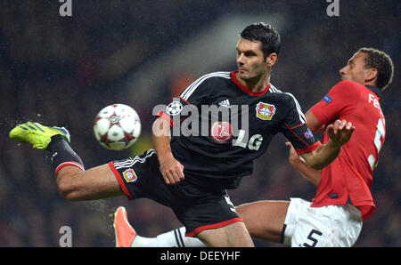 Manchester, UK. 17th Sep, 2013.  Rio Ferdinand (R) and Emir Spahic of Leverkusen vie for the ball during the UEFA Champions League group A soccer match between Manchester United and Bayer 04 Leverkusen at Old Trafford stadium in Manchester, England, 17 September 2013. Photo: Federico Gambarini/dpa/Alamy Live News Stock Photo