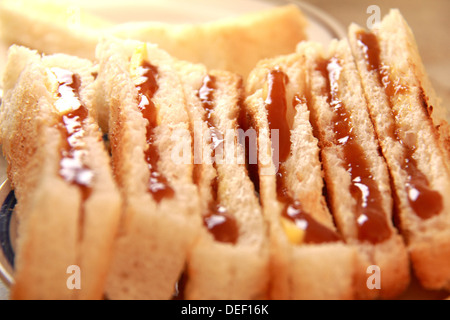 Traditional homemade toasted bread with coconut jam on plate Stock Photo