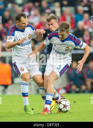 Munich's Xherdan Shaqiri (C) and Moscow's Sergei Ignashevich (L) and Pontus Wernbloom vie for the ball during the UEFA Champions League Group D soccer match between FC Bayern Munich and CSKA Moscow at München Arena in Munich, Germany, 17 September 2013. Photo: Marc Müller/dpa Stock Photo